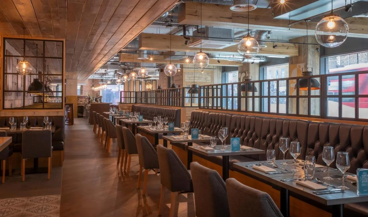 Tables and chairs in the restaurant at Maldron Hotel Finsbury Park, London